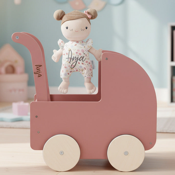 Doll's pram with baby doll, pink
