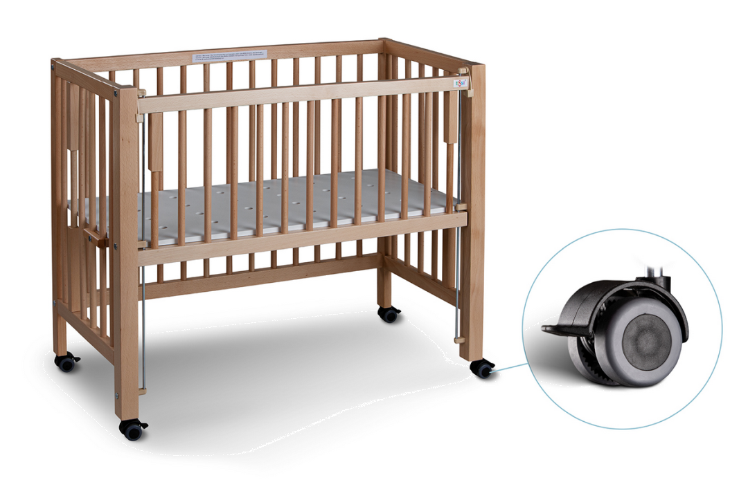 Natural beech wood bedside crib with adjustable height, wheels with brakes, and detachable safety rail included.